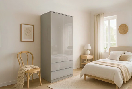A grey high gloss wardrobe with drawers in a japandi styled bedroom, reflecting the elements in the room.