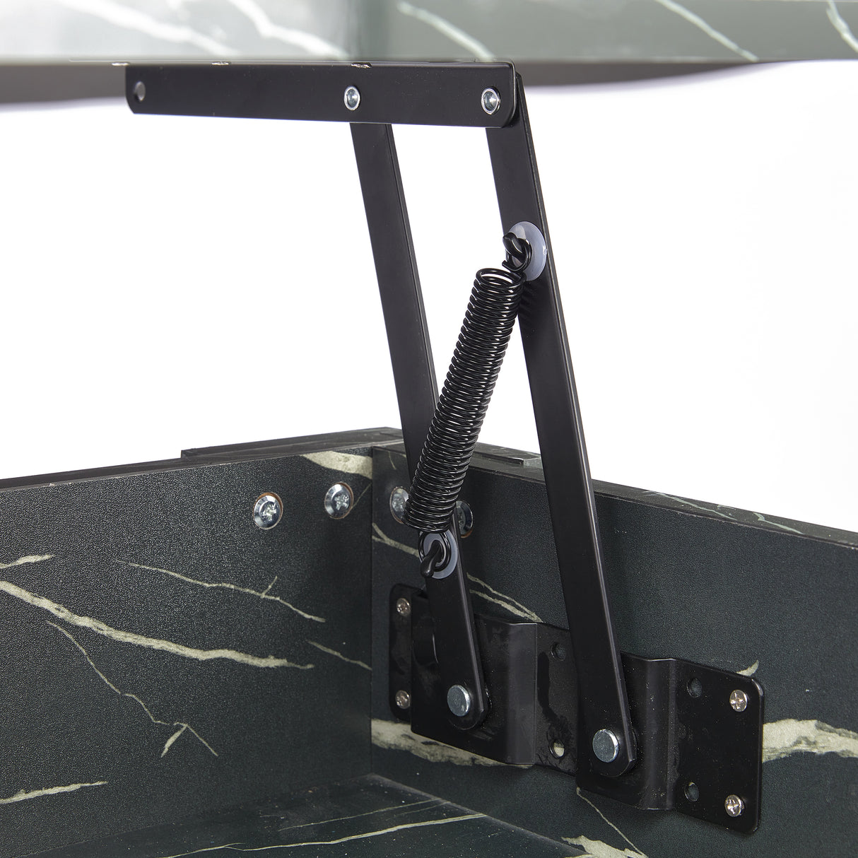 Close-up of lift top mechanism on high gloss lift top coffee table with hidden storage shelf. Features black metal spring hinge for smooth lifting.
