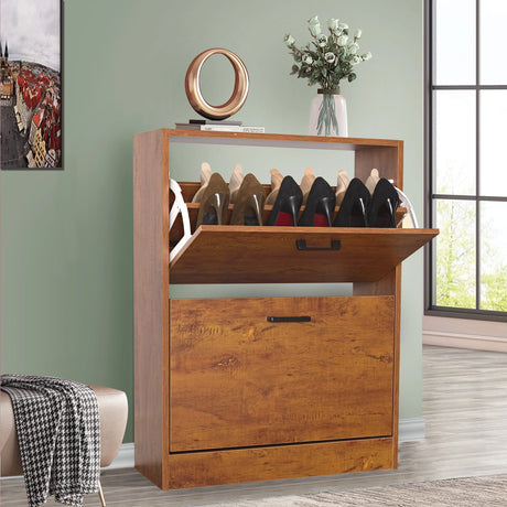 With its pull-down drawer open, this oak shoe cabinet 2 door is styled with a potted plant and decor on the top surface.