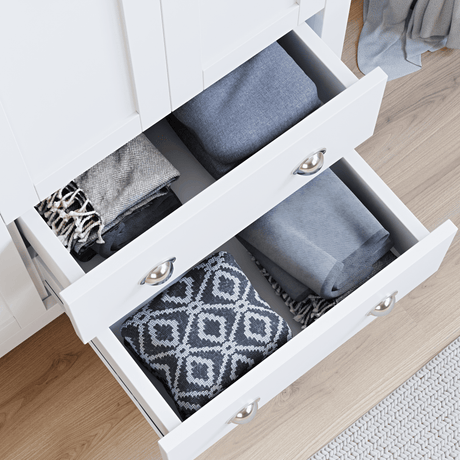 Shaker 3 Door Wardrobe, 4 Chest of Drawers | Bedroom Set with open drawers showing neatly folded clothes in a modern white finish for organized storage.