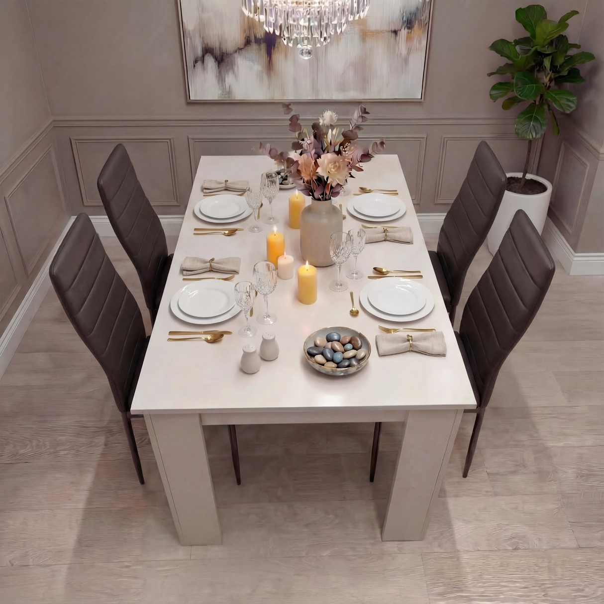 Dining room with a table set for dinner, featuring plates, candles, and flowers.