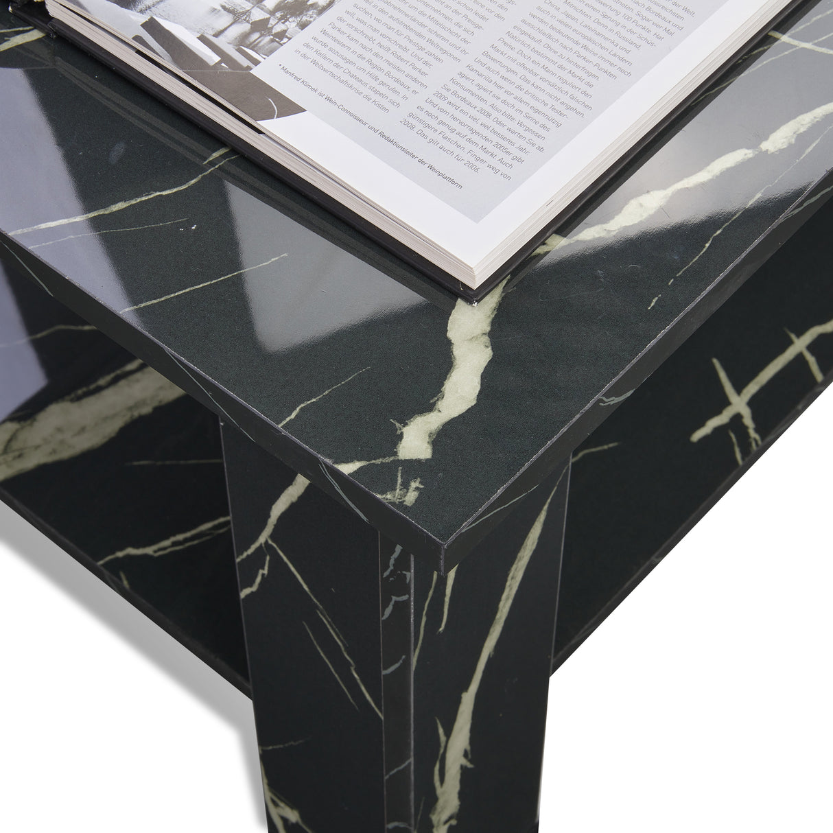 High gloss lift top coffee table with hidden storage shelf in black marble finish. Modern designer coffee table ideal for stylish UK living rooms.