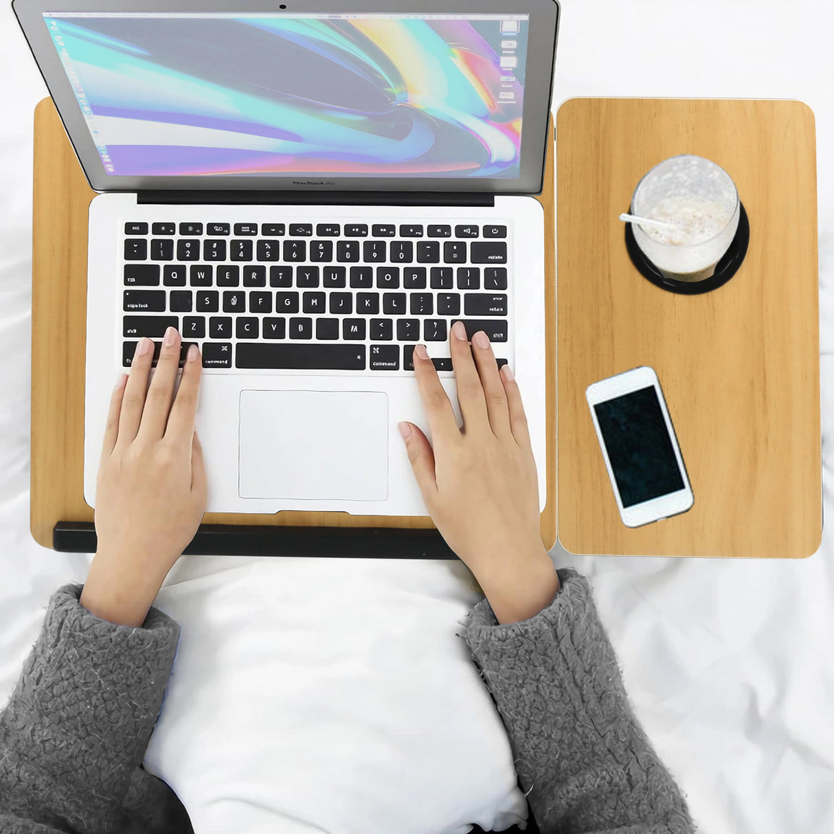 pine folding laptop table shown from above with hands using a laptop, surface lifted for comfort