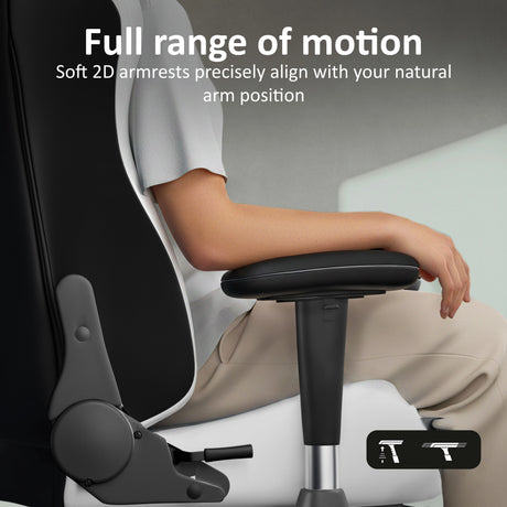 Person sitting on a ergonomic chair with text highlighting full range of motion and soft armrests.