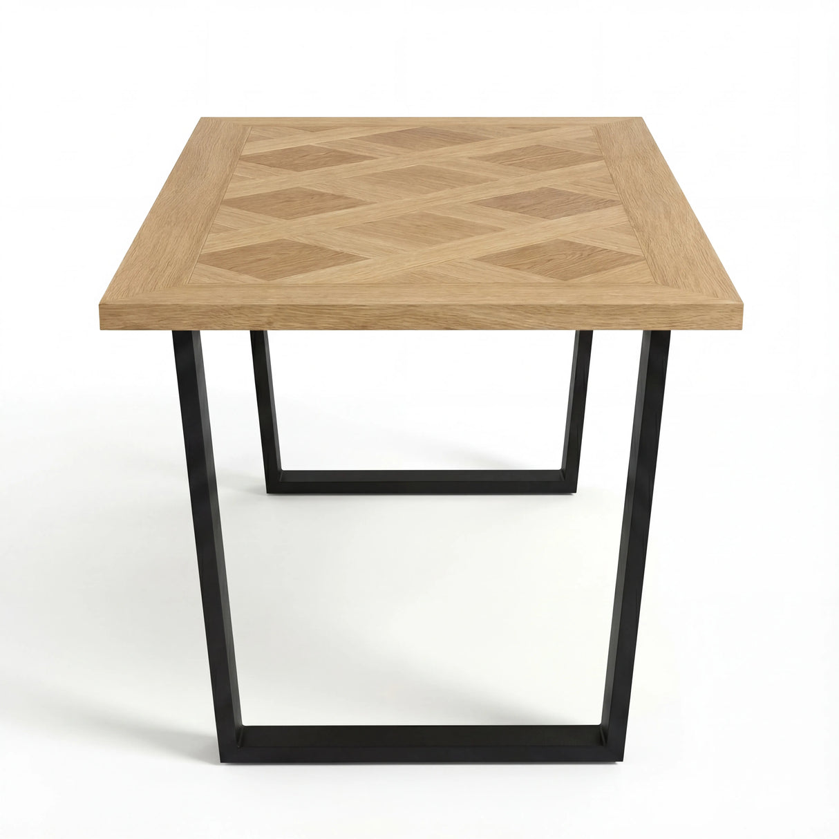 Side view of the Aldridge dining table showcasing its intricate geometric wood design. Black metal base complements the pattern.