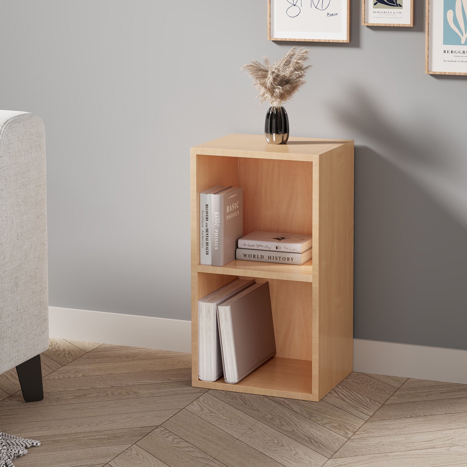 angled front view of 2 tier beech baby bookcase styled with children's books and toys for a playful nursery