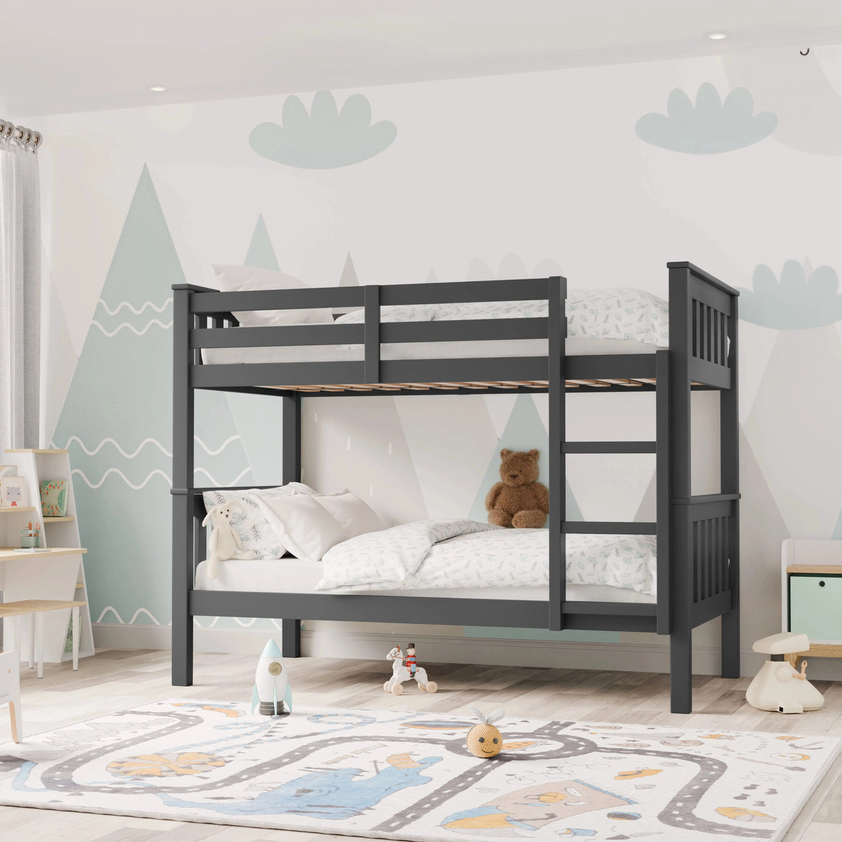 angled front view of dark grey double bed bunk bed frame showing whole bed placed against a mountain mural wall