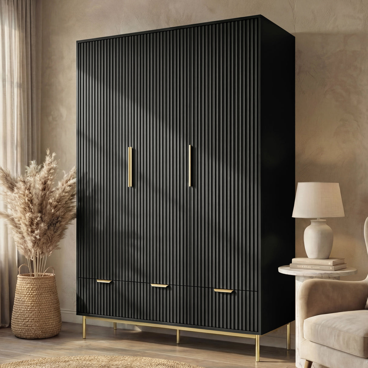 Black three door wardrobe with drawers positioned in room corner beside chair and neutral decor
