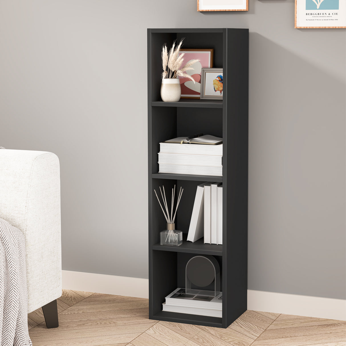 angled front view of  4 tier black narrow bookcase with books and decor, perfect for tight spaces