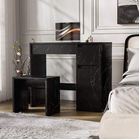 Modern black makeup dressing table with flip-up mirror, marble finish, storage drawers, and matching stool in a bedroom setting.