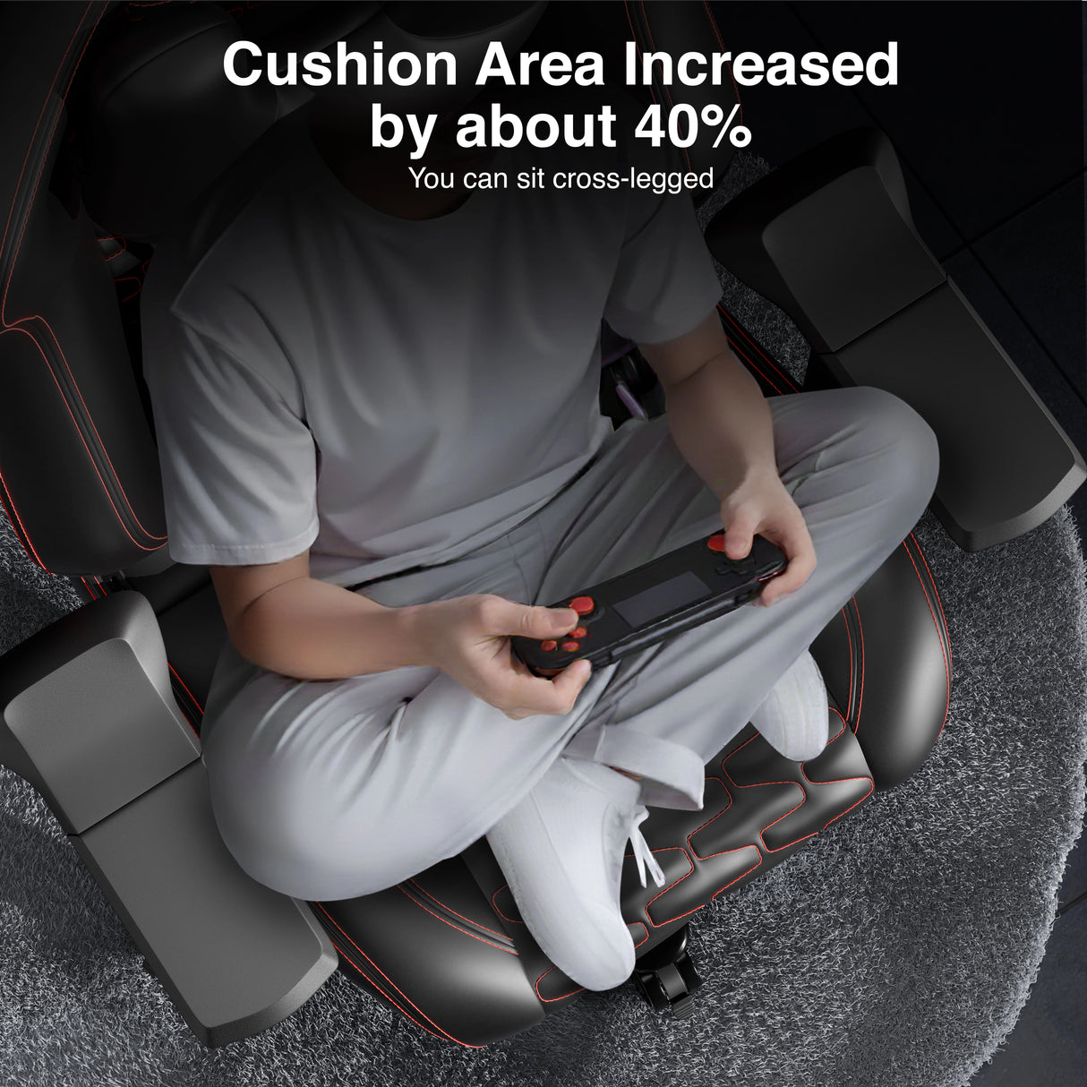 Person using a massage chair with increased cushion area, sitting cross-legged.