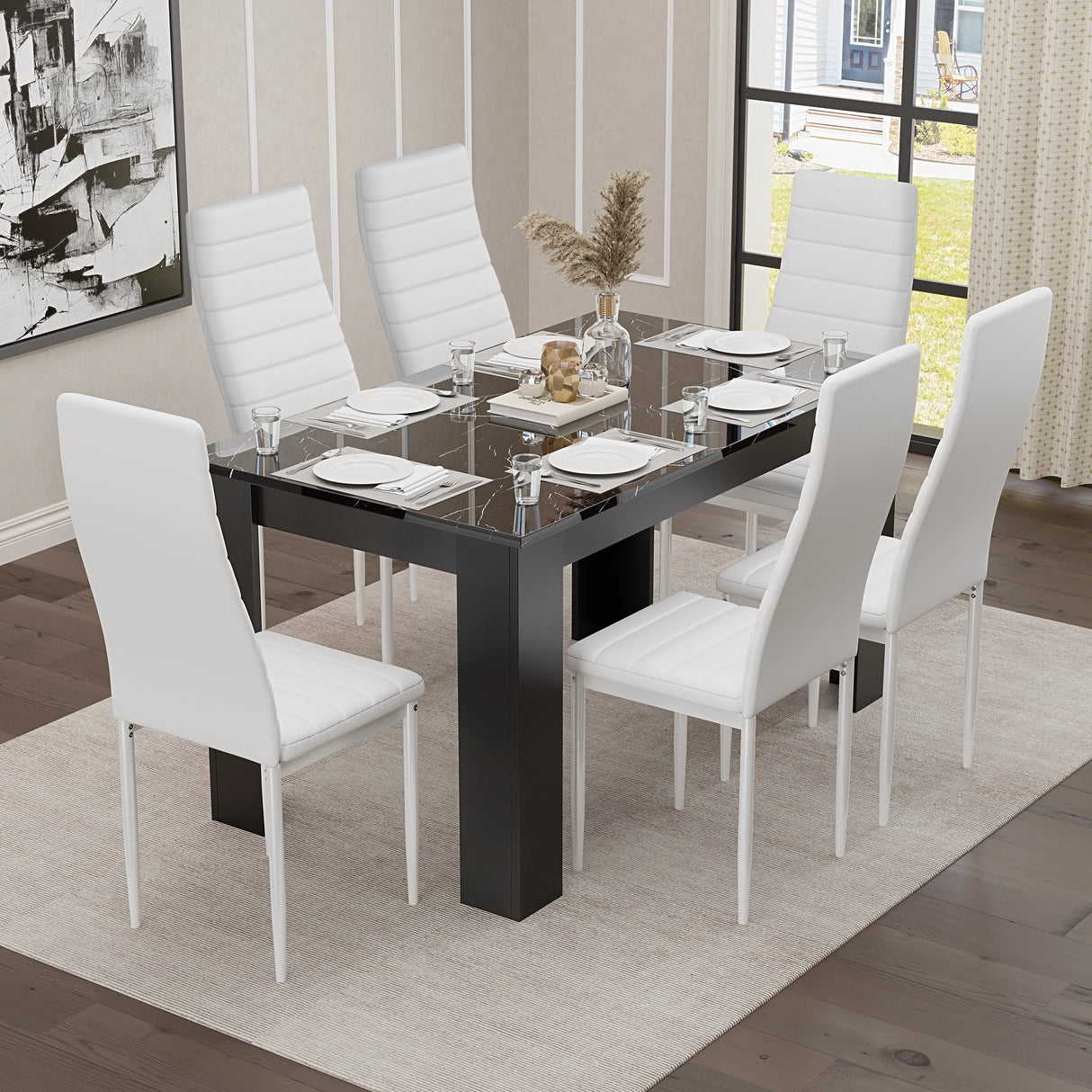 Gloss black marble dining table with six white faux leather chairs, perfect for bright, modern interiors.
