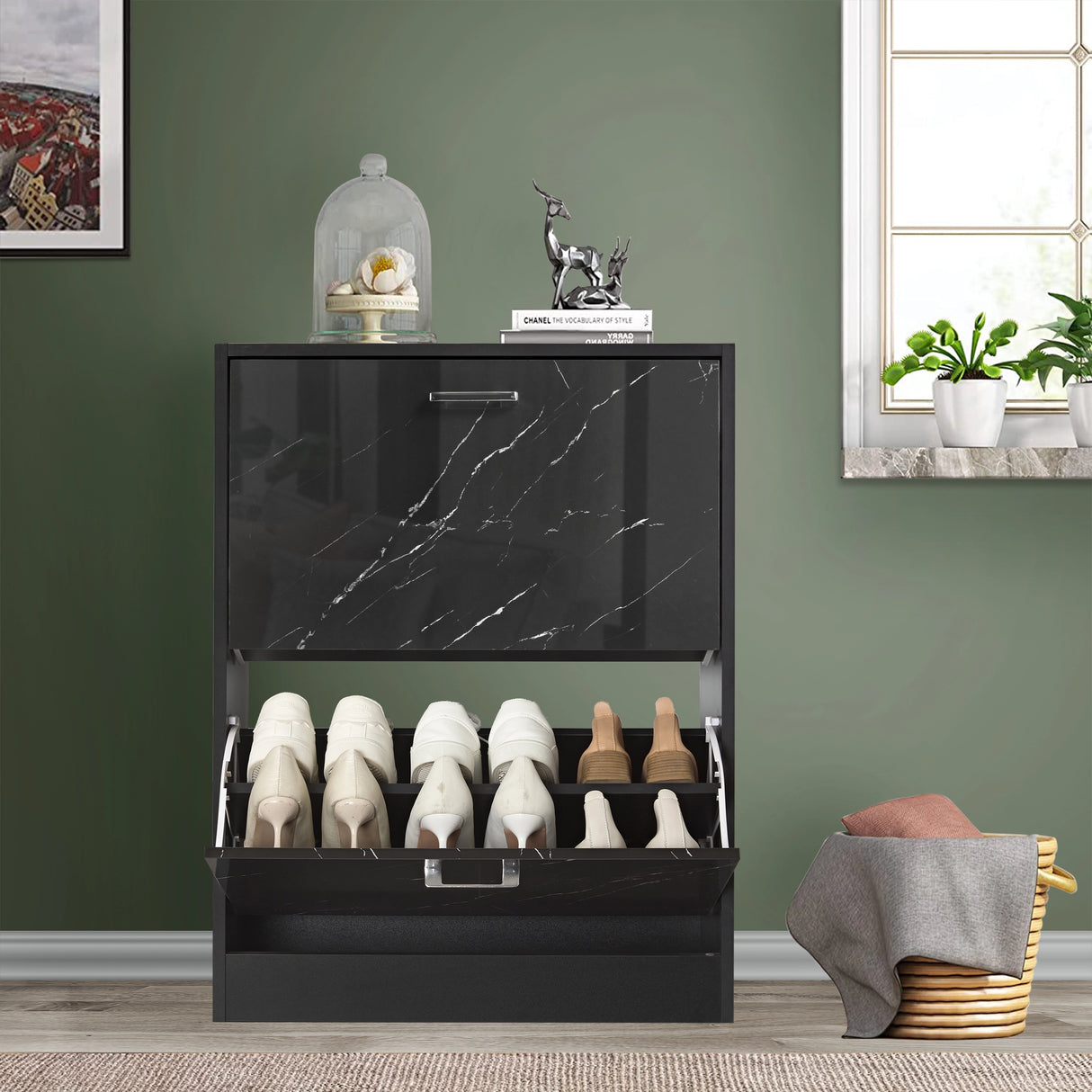 This 12 pair shoe storage cabinet features a black marble pull-down drawer open at the bottom, revealing boots and sneakers.