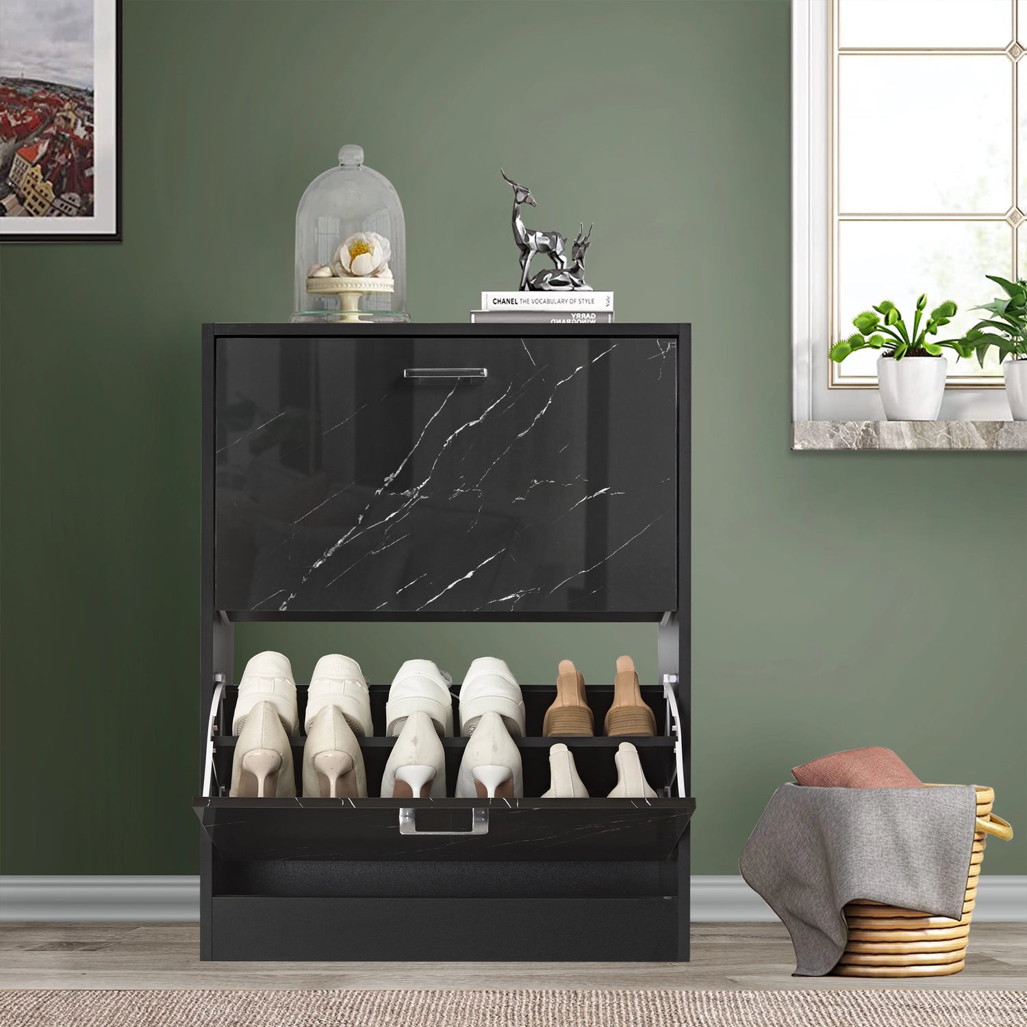 This 12 pair shoe storage cabinet features a black marble pull-down drawer open at the bottom, revealing boots and sneakers.