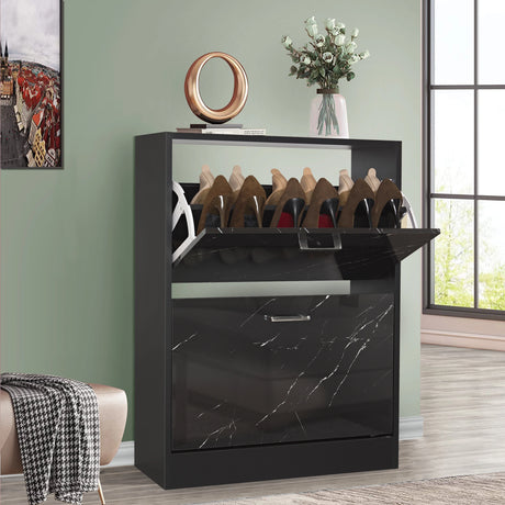 Small shoe storage in black marble finish, showing a 2-door pull-down cabinet topped with stylish decor and greenery.