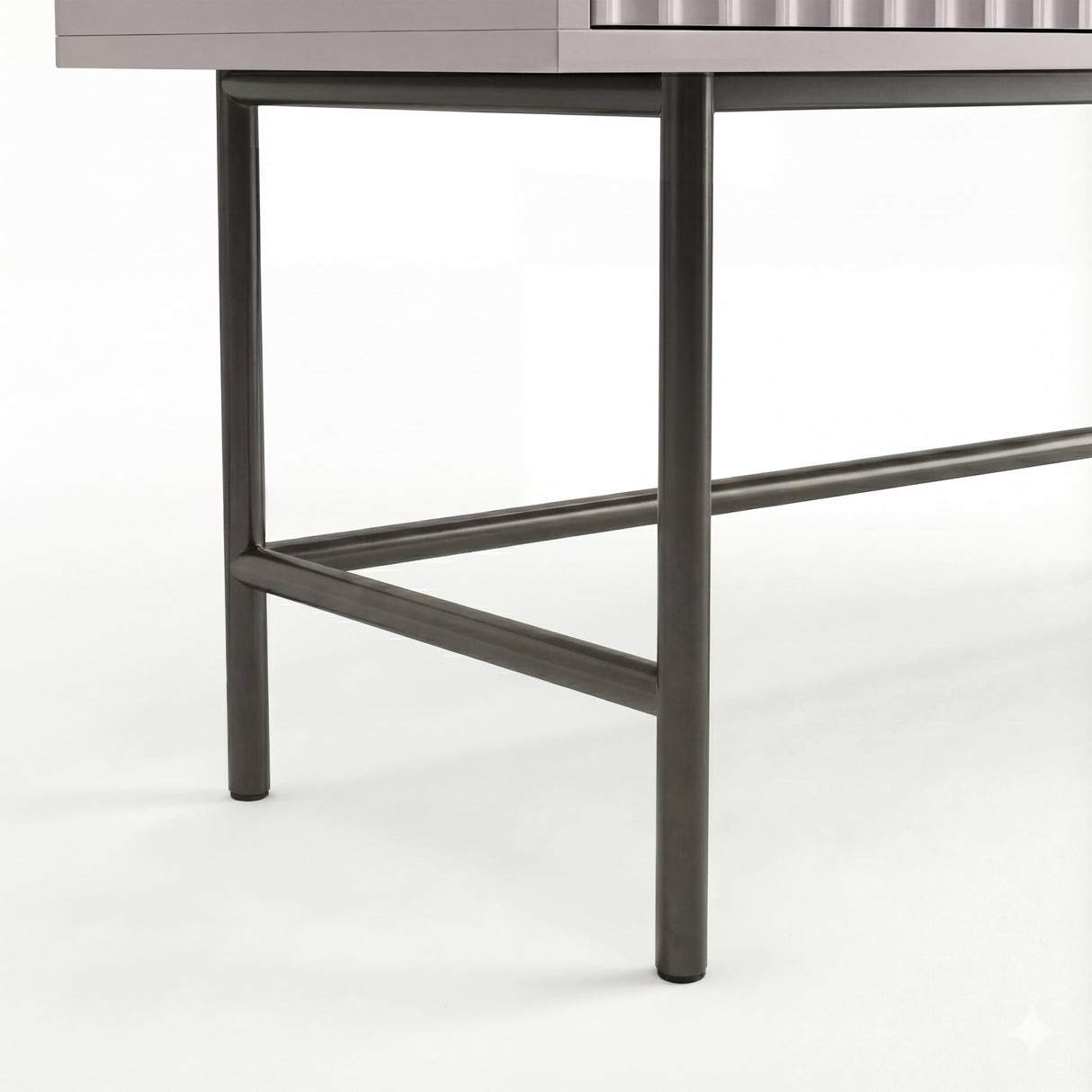 Close-up view of the black metal legs supporting the clean, modern design of a dressing table with a sturdy framework