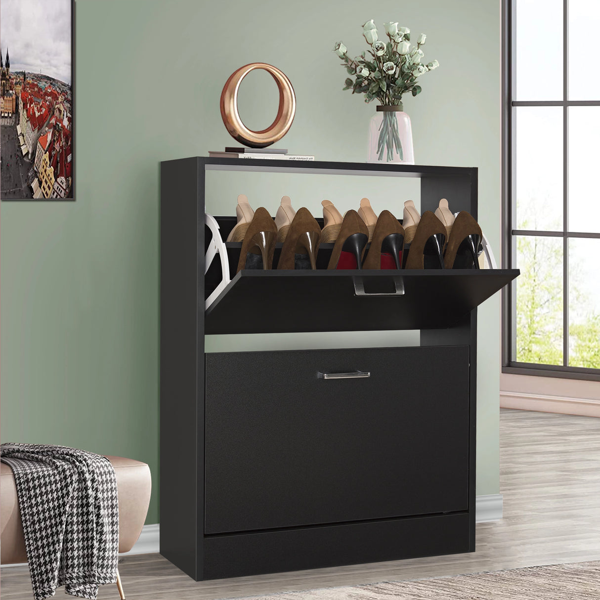 Black shoe cabinet 2 door with the top pull-down drawer open with art piece and a potted plant displayed on top.