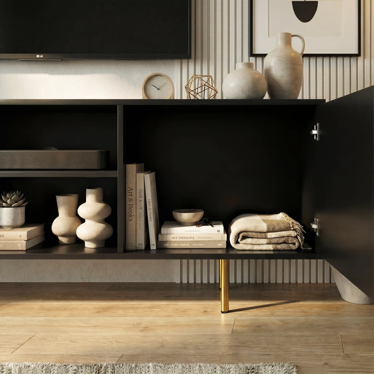 Black TV cabinet with open central shelving and fluted doors, showcasing organized storage for media and home decor.
