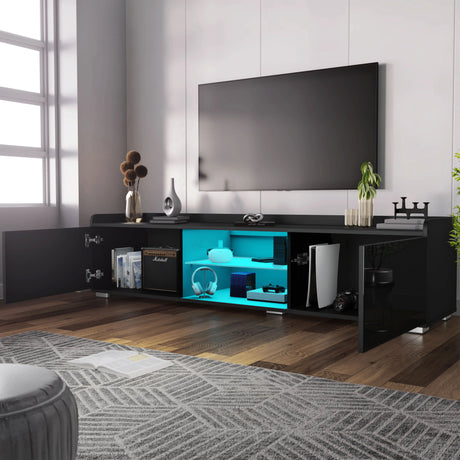 Modern black TV stand with a blue illuminated shelf in a living room setting.