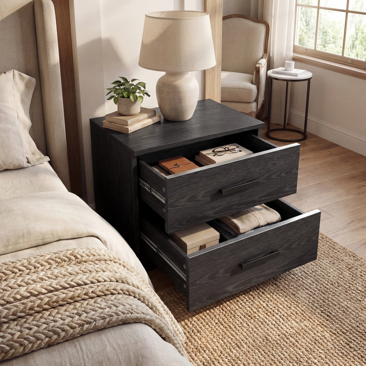 Black two drawer nightstand with both drawers open displaying interior storage capacity