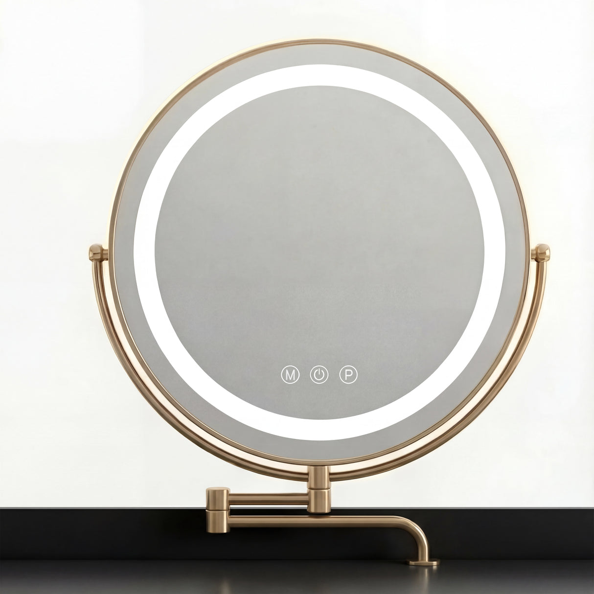 A round mirror with integrated lighting on a black vanity table, featuring a sleek gold stand design with three colours