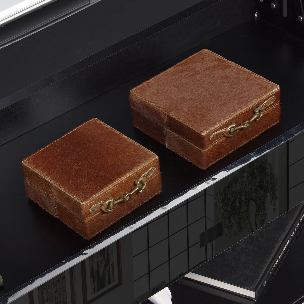 High Gloss Lift Top Coffee Table With Hidden Storage Shelf featuring a black glossy surface and two brown leather storage boxes inside the hidden compartment.