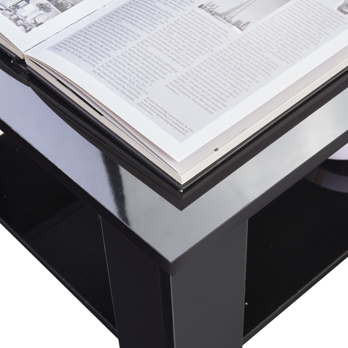High Gloss Lift Top Coffee Table With Hidden Storage Shelf featuring a sleek black finish and open book on top, ideal for modern living rooms.