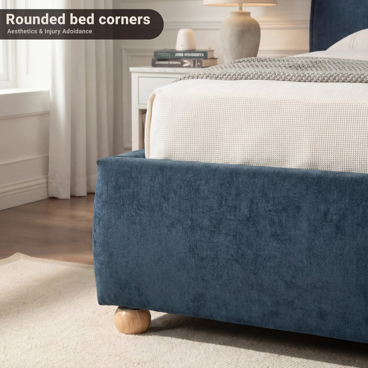 Lower section of the bed showing fabric-wrapped edges and rounded corners on a wooden flooring