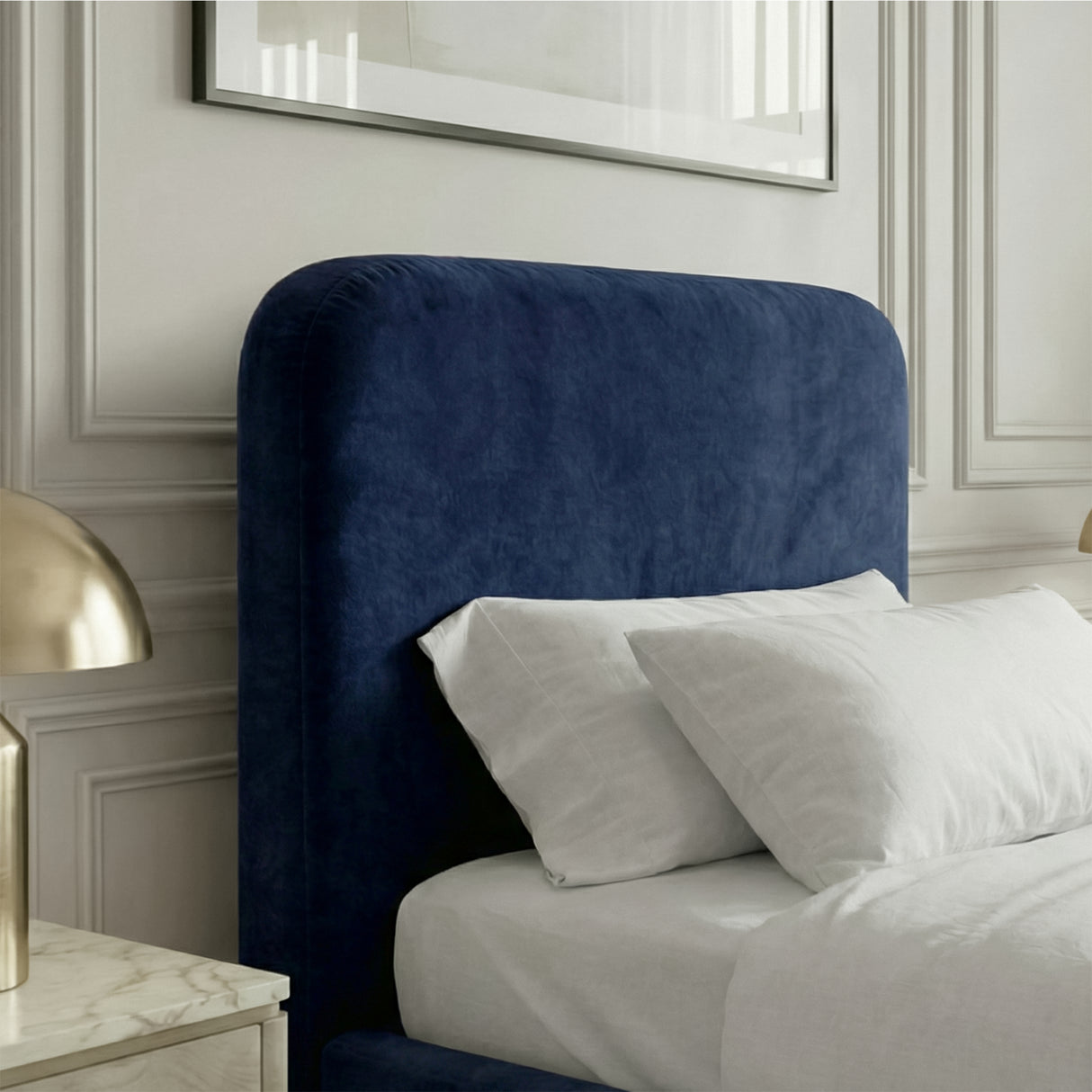 "Close view of blue velvet single bed headboard with curved upholstered design and soft padded fabric finish
"