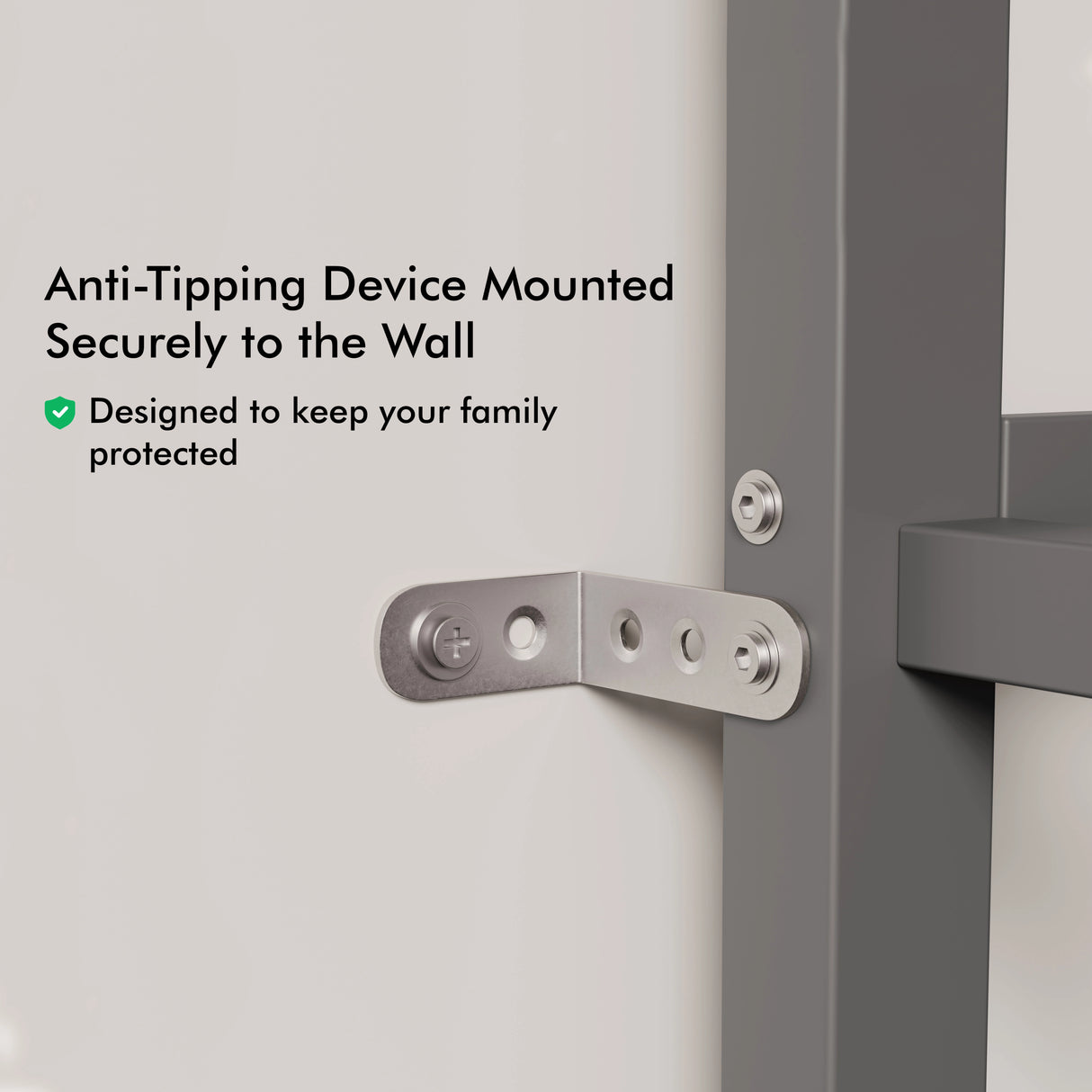 Close up of metal anti tipping mechanism attached to a wall and a single bunk bed with desk.