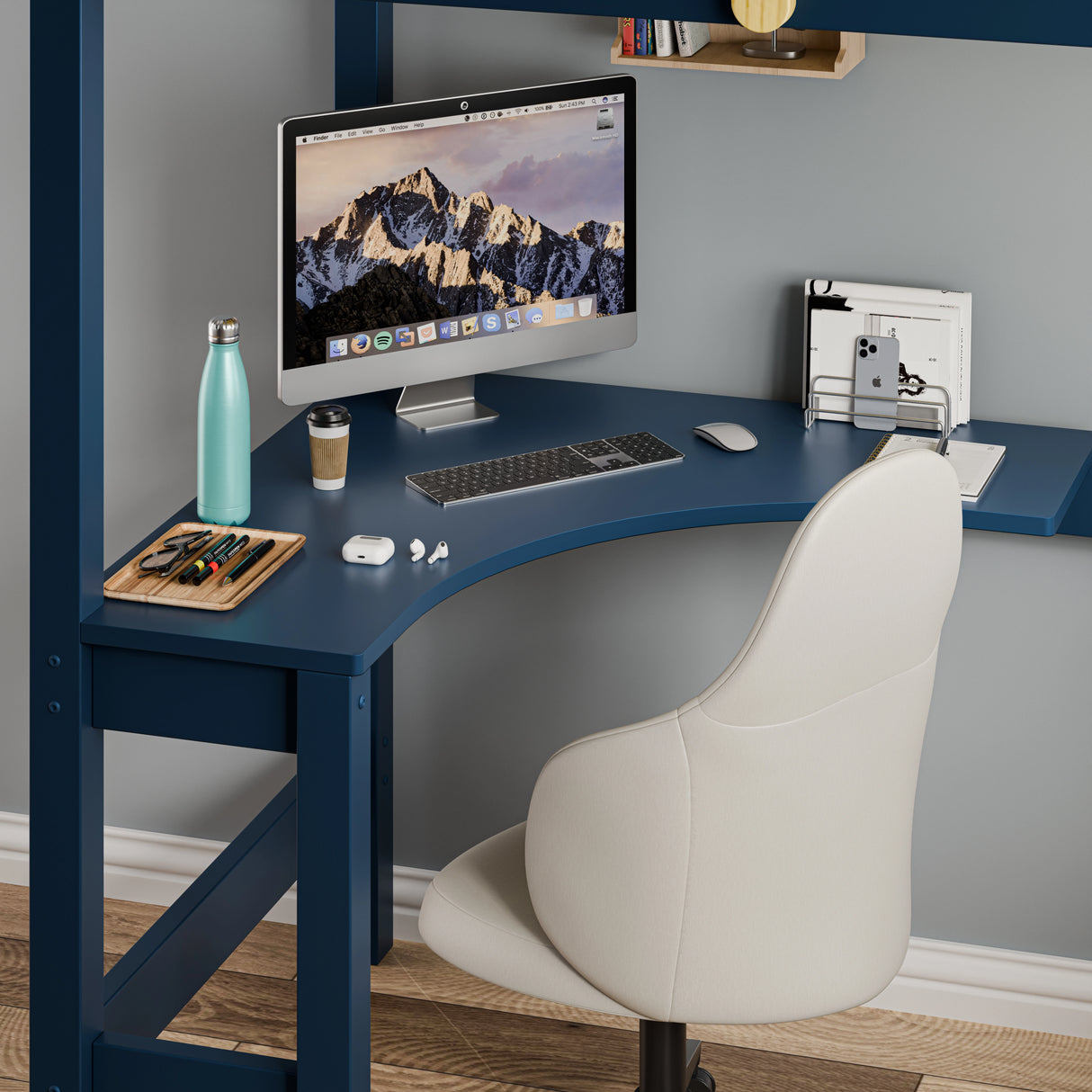 Bunk bed with desk setup, showing a bunk bed with a curved blue desk underneath, complete with a chair, computer.