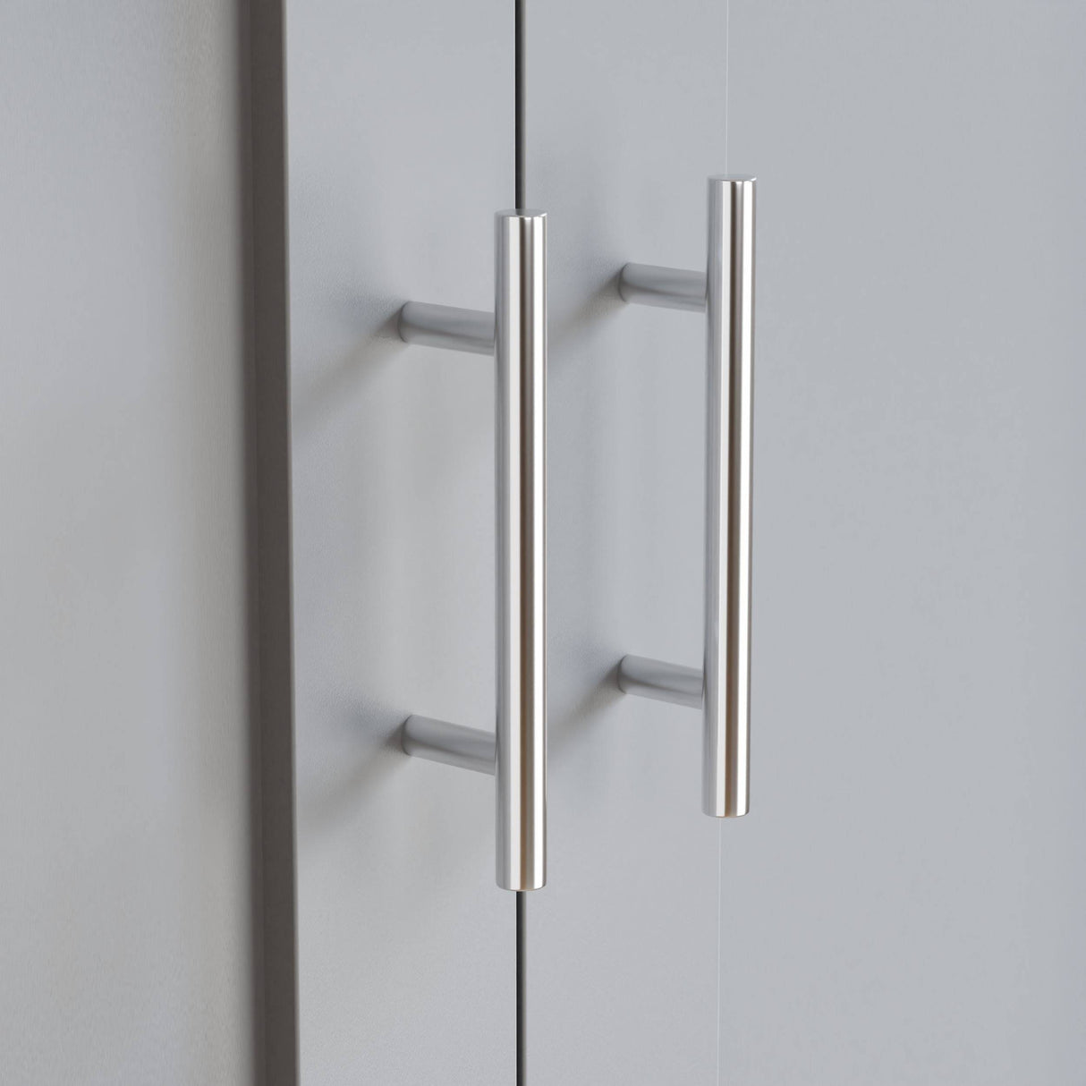 Close-up of Shaker 2 Door Wardrobe handles in brushed metal finish, part of the Shaker 2 Door Wardrobe, 5 Chest of Drawers Bedroom Set.