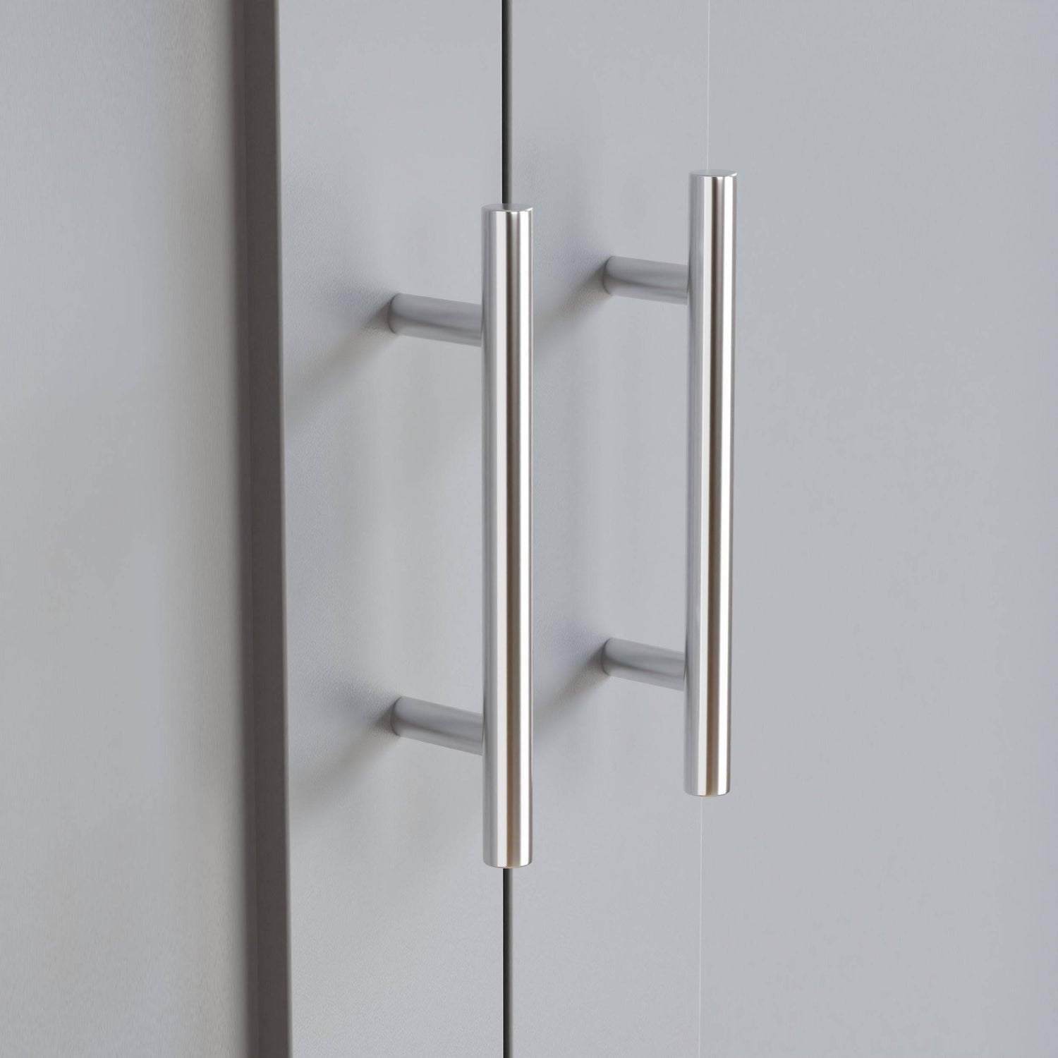 Close-up of Shaker 2 Door Wardrobe handles in brushed metal finish, part of the Shaker 2 Door Wardrobe, 5 Chest of Drawers Bedroom Set.
