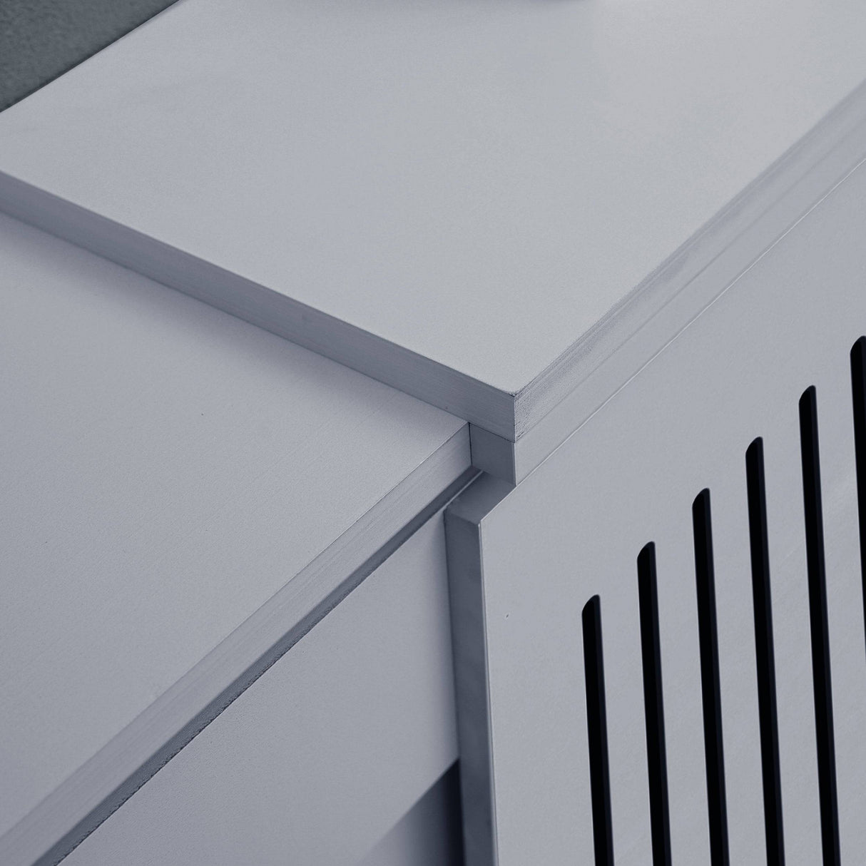 detailed view of adjustable section on extra large adjustable radiator covers in grey paint finish