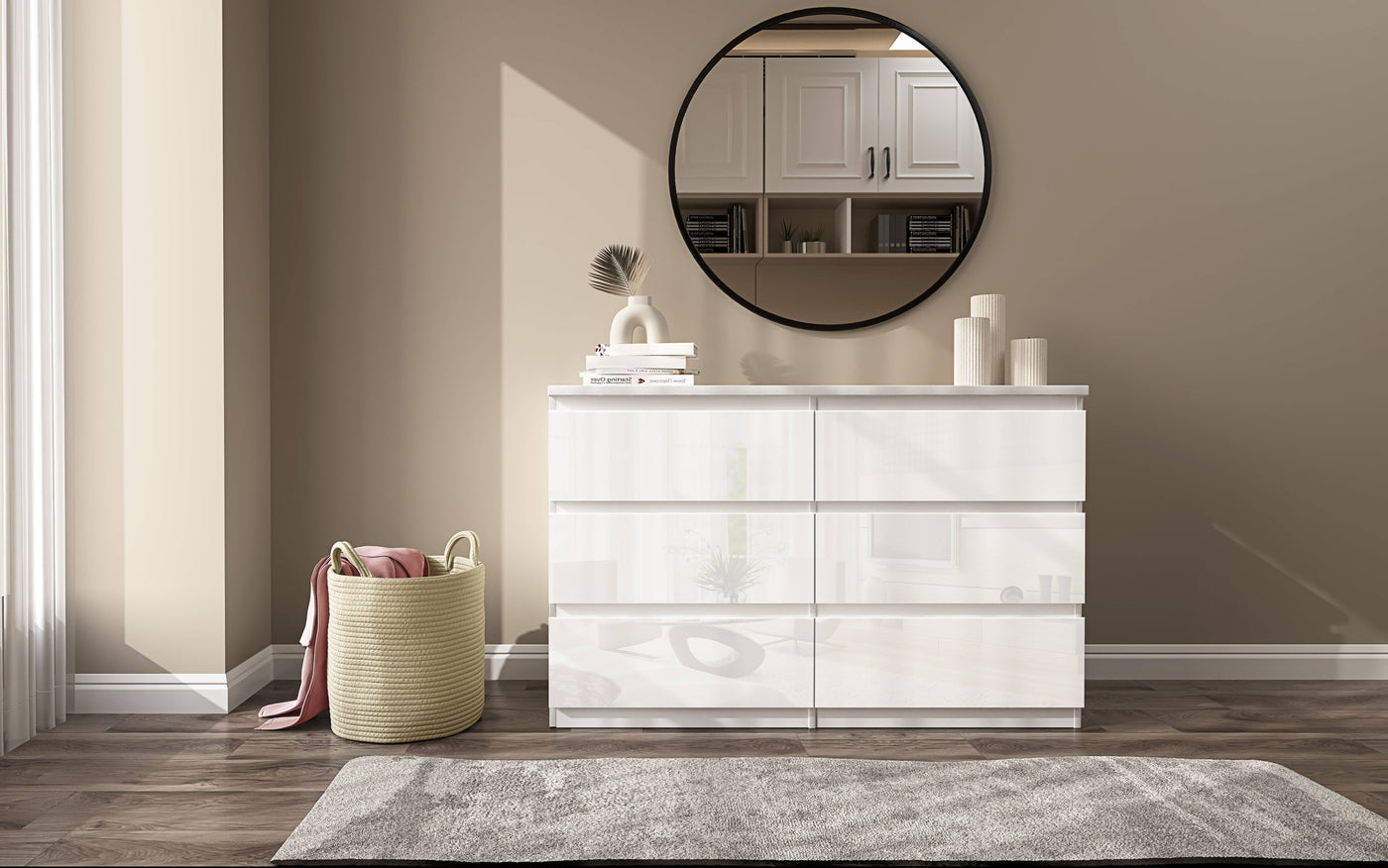 White dresser with decorative items in a room with a mirror and rug.
