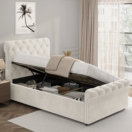 Chesterfield Ottoman Storage Bed in beige with side lift mechanism, tufted headboard and footboard, and under-bed storage filled with boxes and linens.