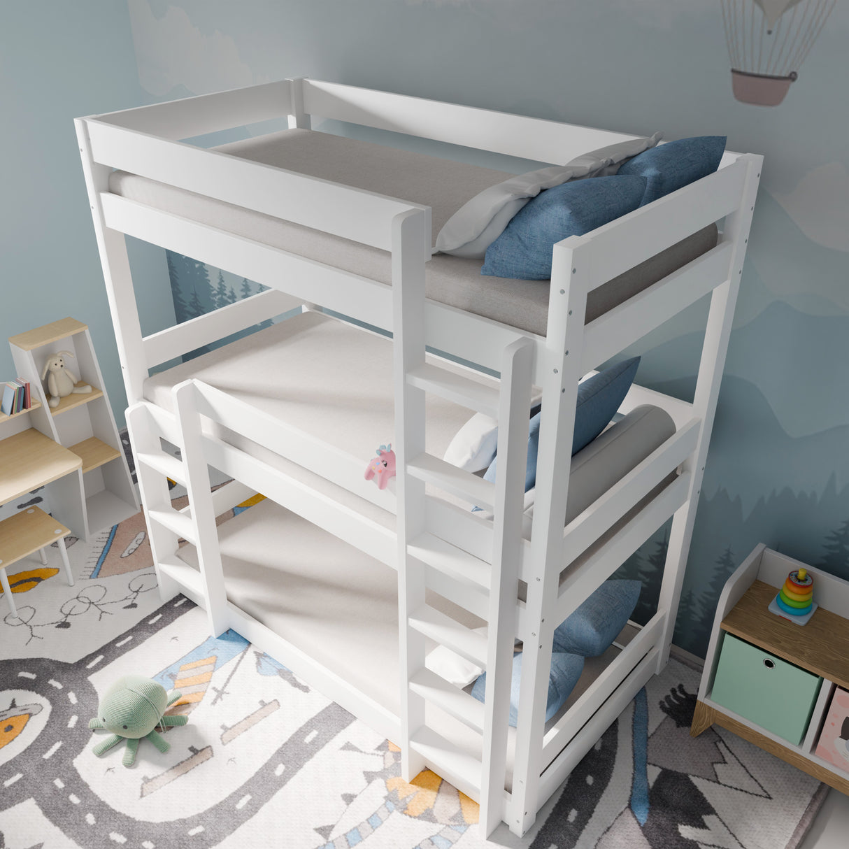 High-angle view of children's triple bunk beds in white, showing ladders, guardrails, and compact design