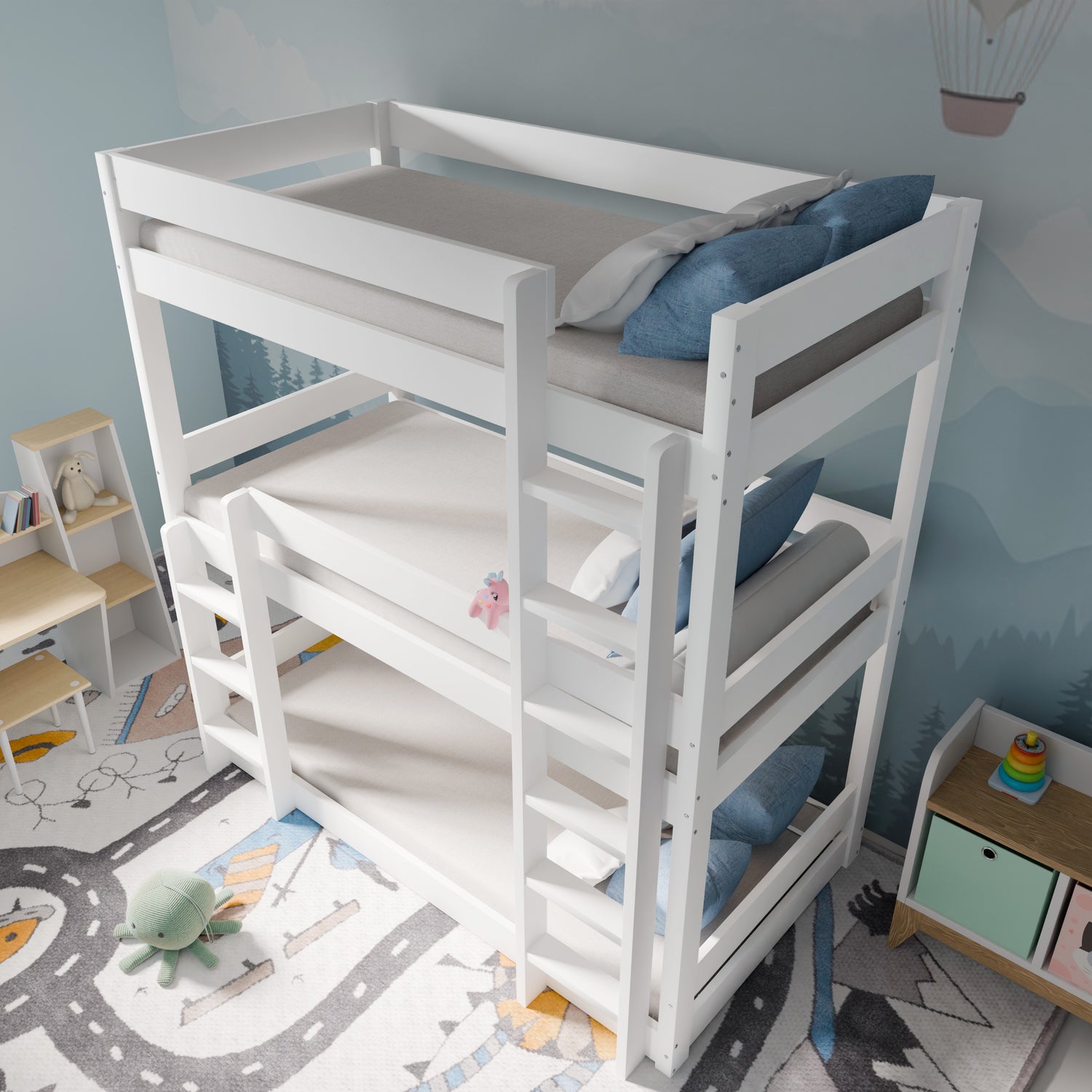 High-angle view of children's triple bunk beds in white, showing ladders, guardrails, and compact design