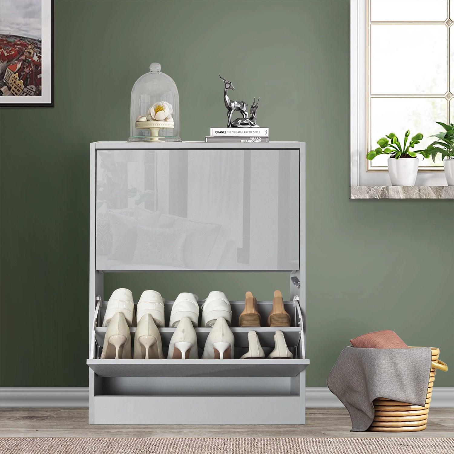 front view of grey gloss small shoe cabinet with soft reflection of nearby living room furniture