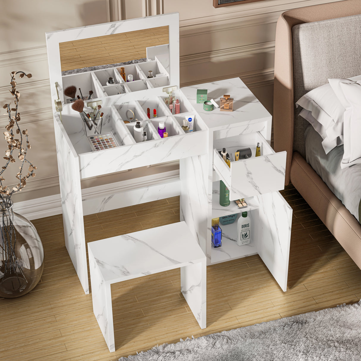 Modern white marble makeup dressing table with flip-up mirror, multiple storage sections, and matching stool beside a bed. Ideal for compact bedrooms.