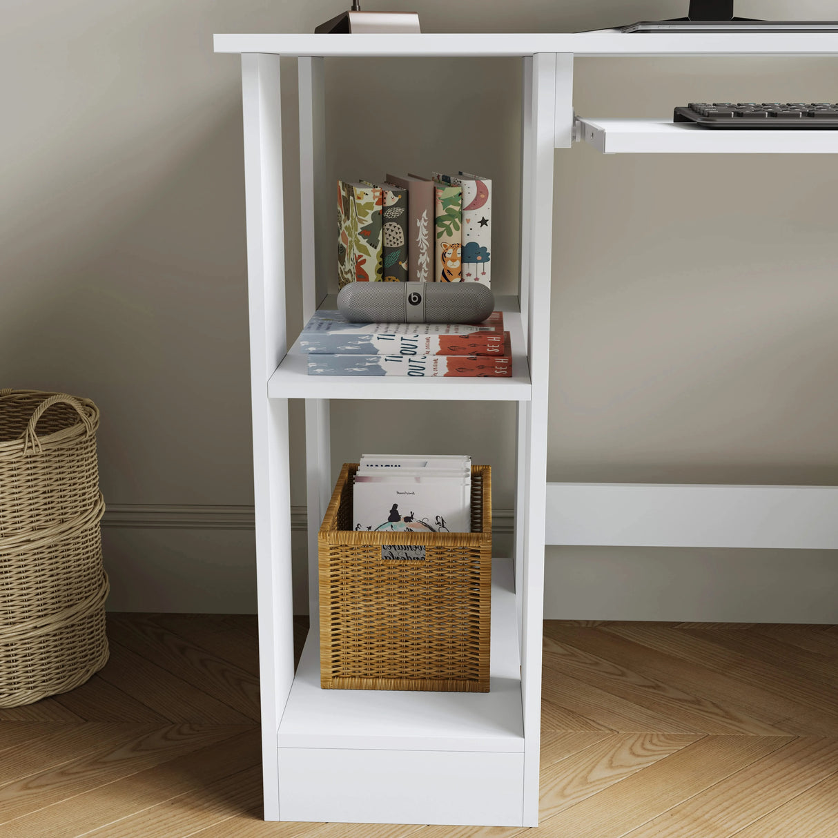 White bookshelf with books and a basket against a neutral wall.