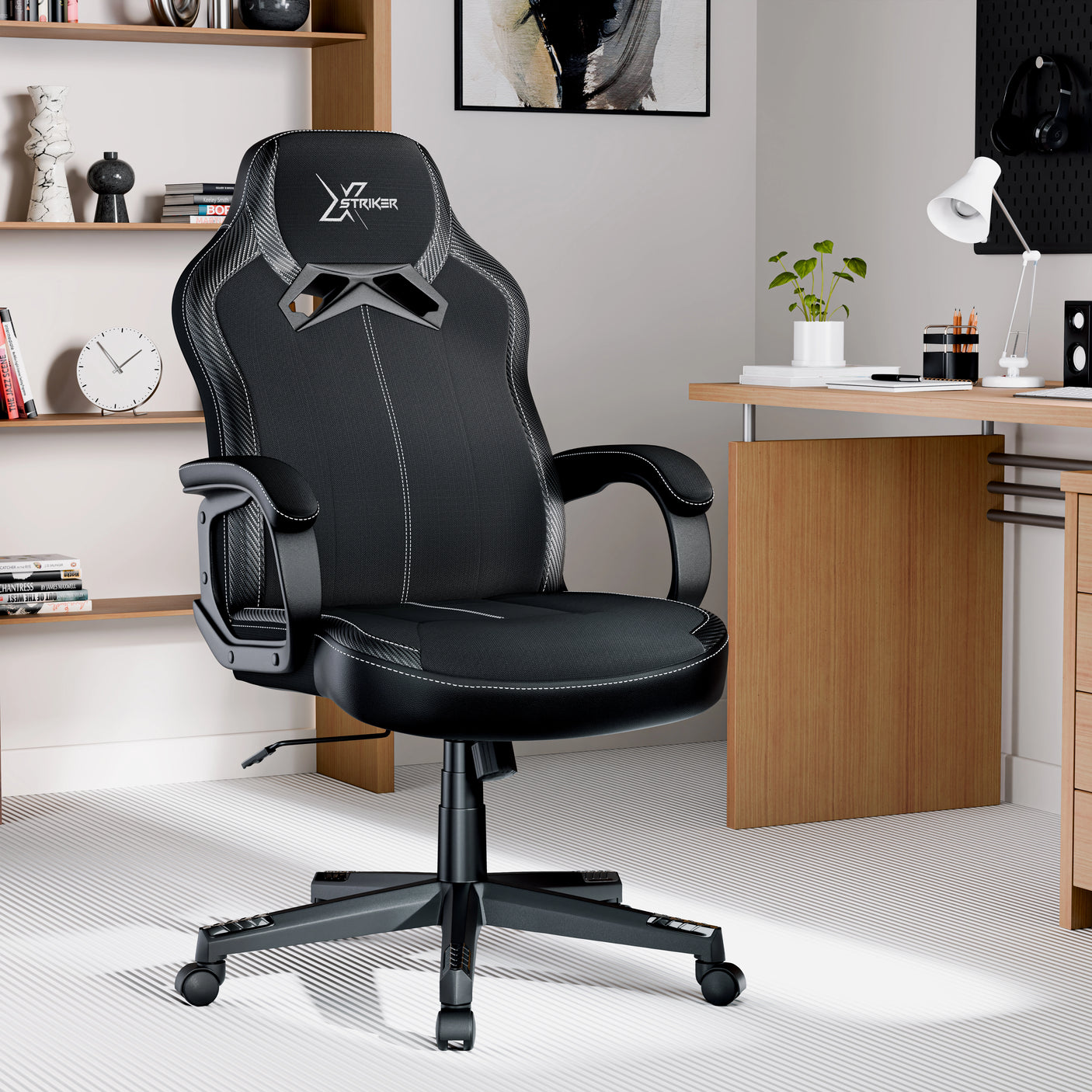Xstriker office chair in black fabric with padded arms and adjustable height, ideal for home office or study desk setup in children's room.