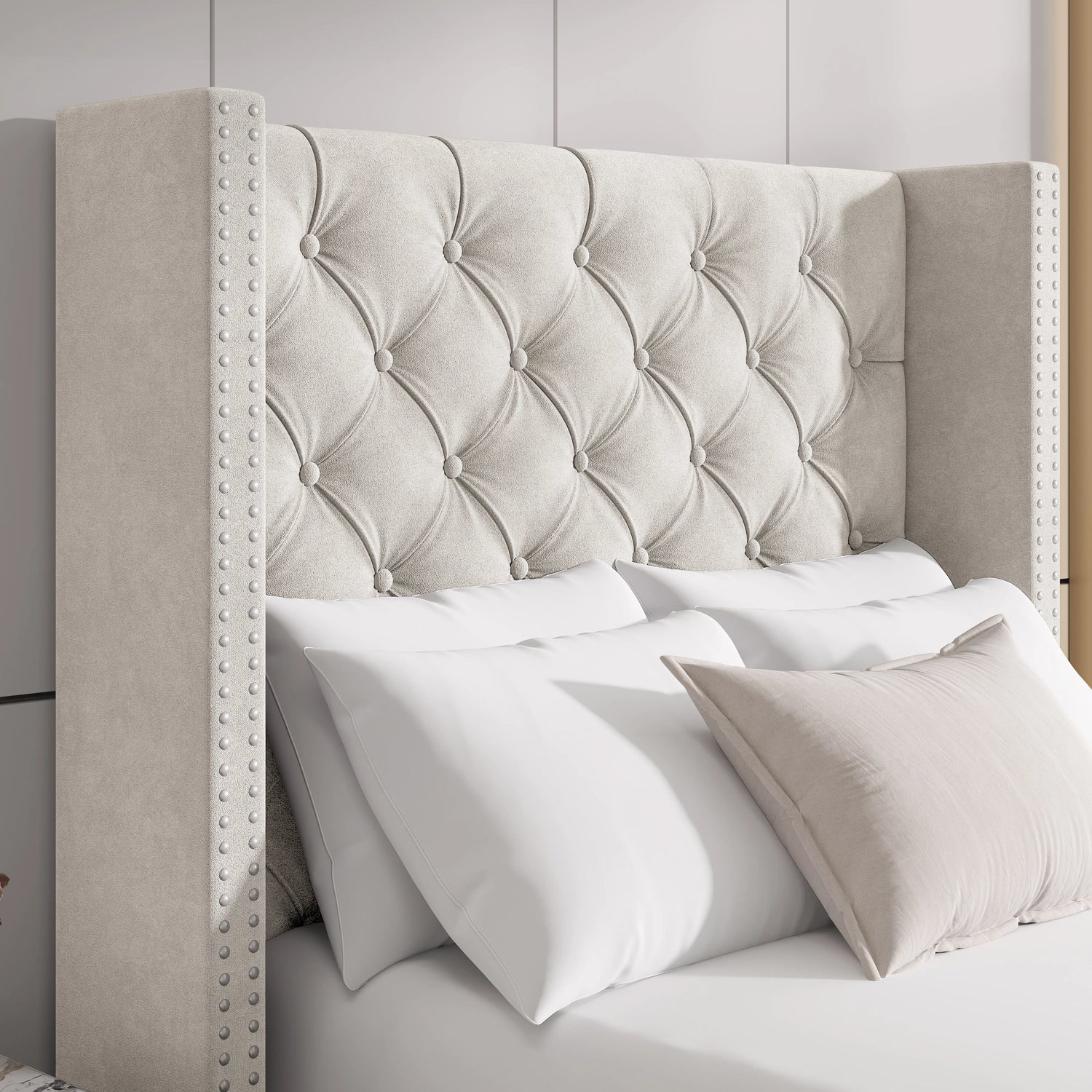 Close-up of beige velvet winged headboard with cross tufted pattern and studded trim, adding a touch of elegance.