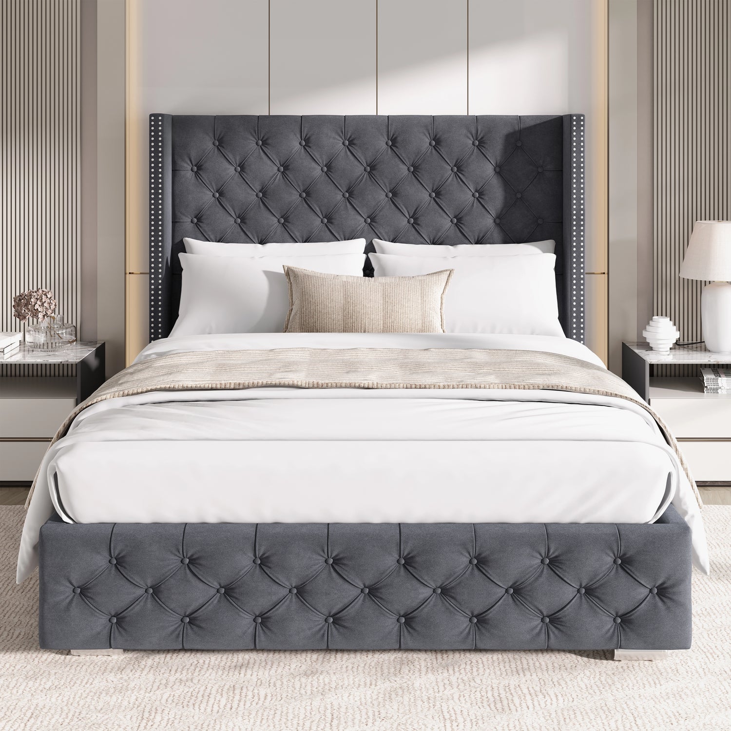 Front view of double dark grey velvet ottoman bed with cross pattern and winged headboard in a stylish bedroom.