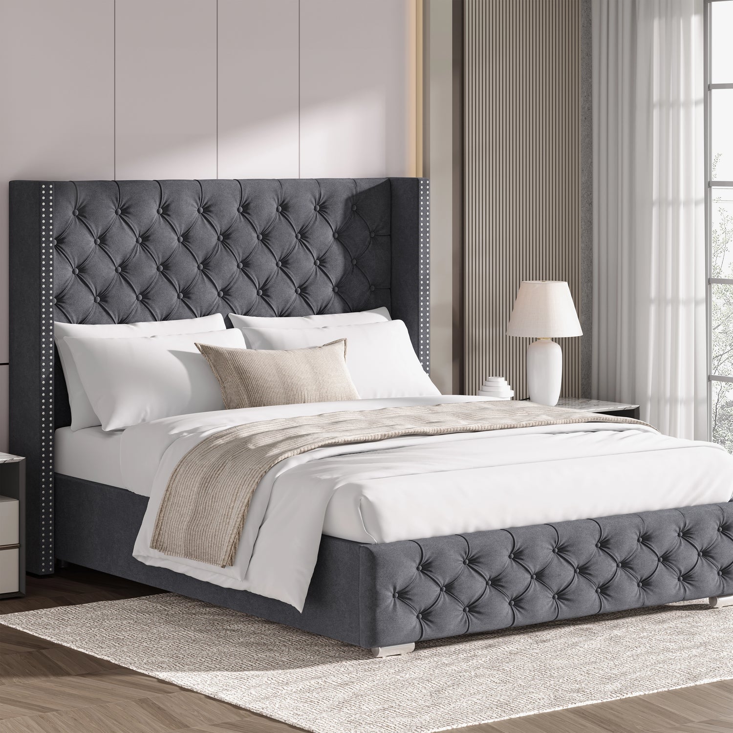 Dark grey double velvet ottoman bed with cross pattern and winged headboard, styled in a modern bedroom.