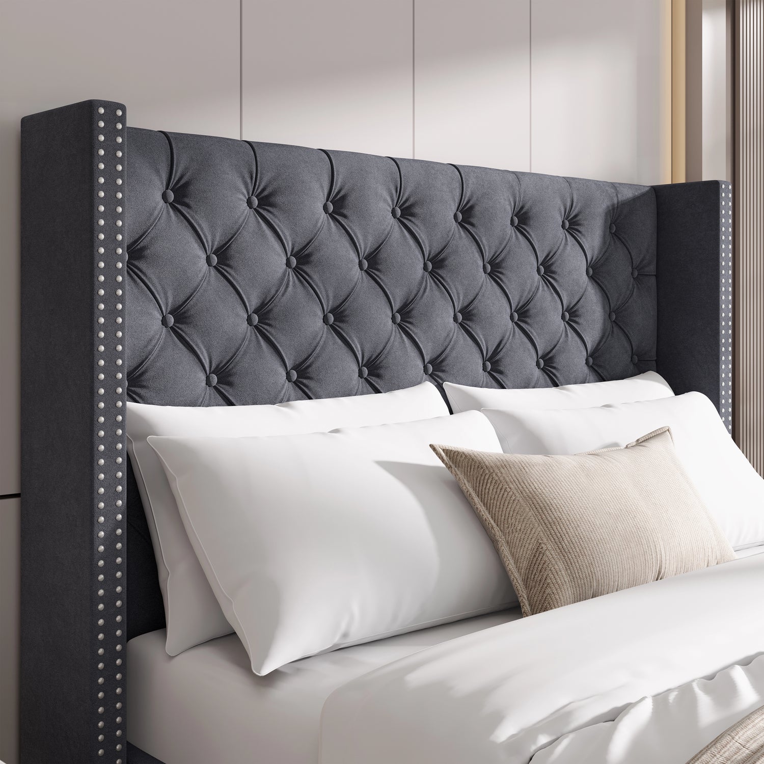 Close-up of small double dark grey velvet headboard with tufted cross pattern and studded winged sides.