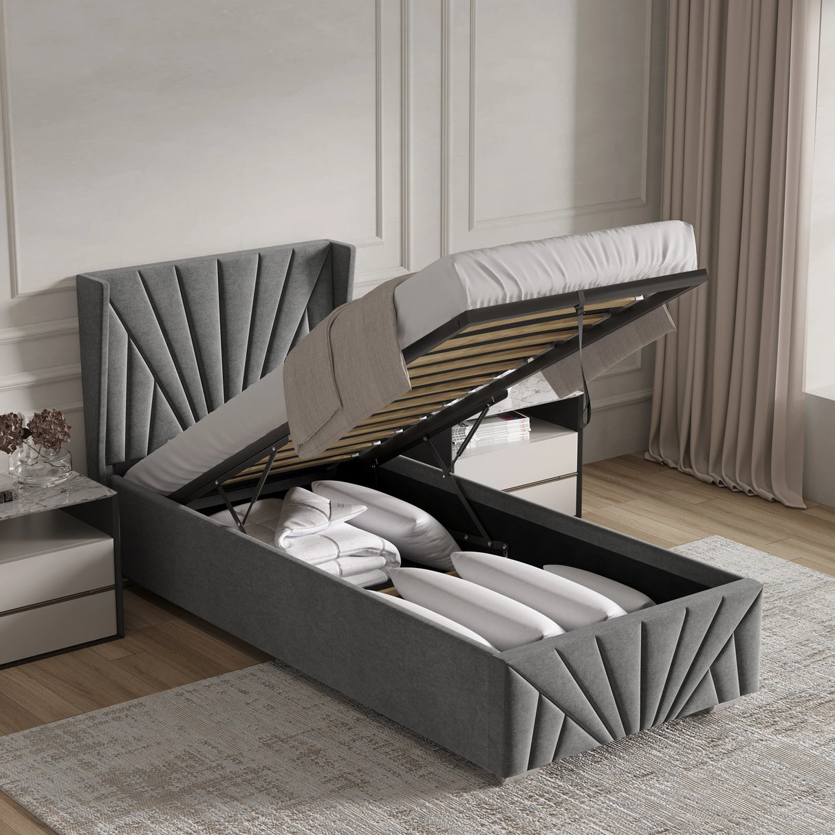 Grey upholstered bed with storage compartments in a bedroom setting.