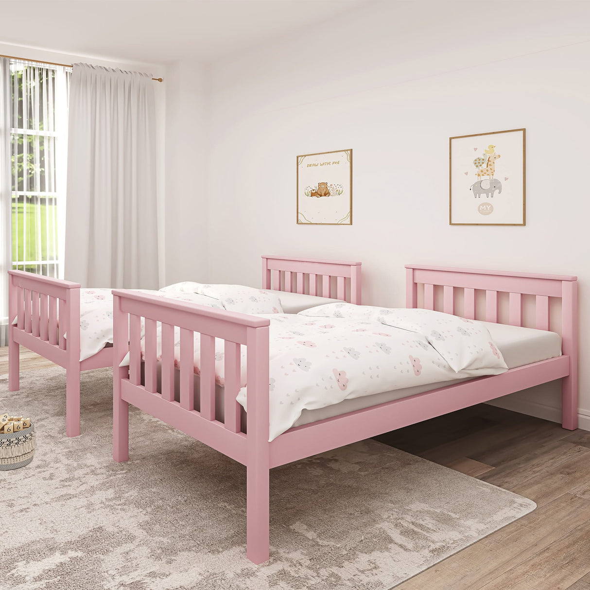 Pink detachable bunk bed shown as two single beds with cream bedding, offering flexible sleeping arrangements for kids.
