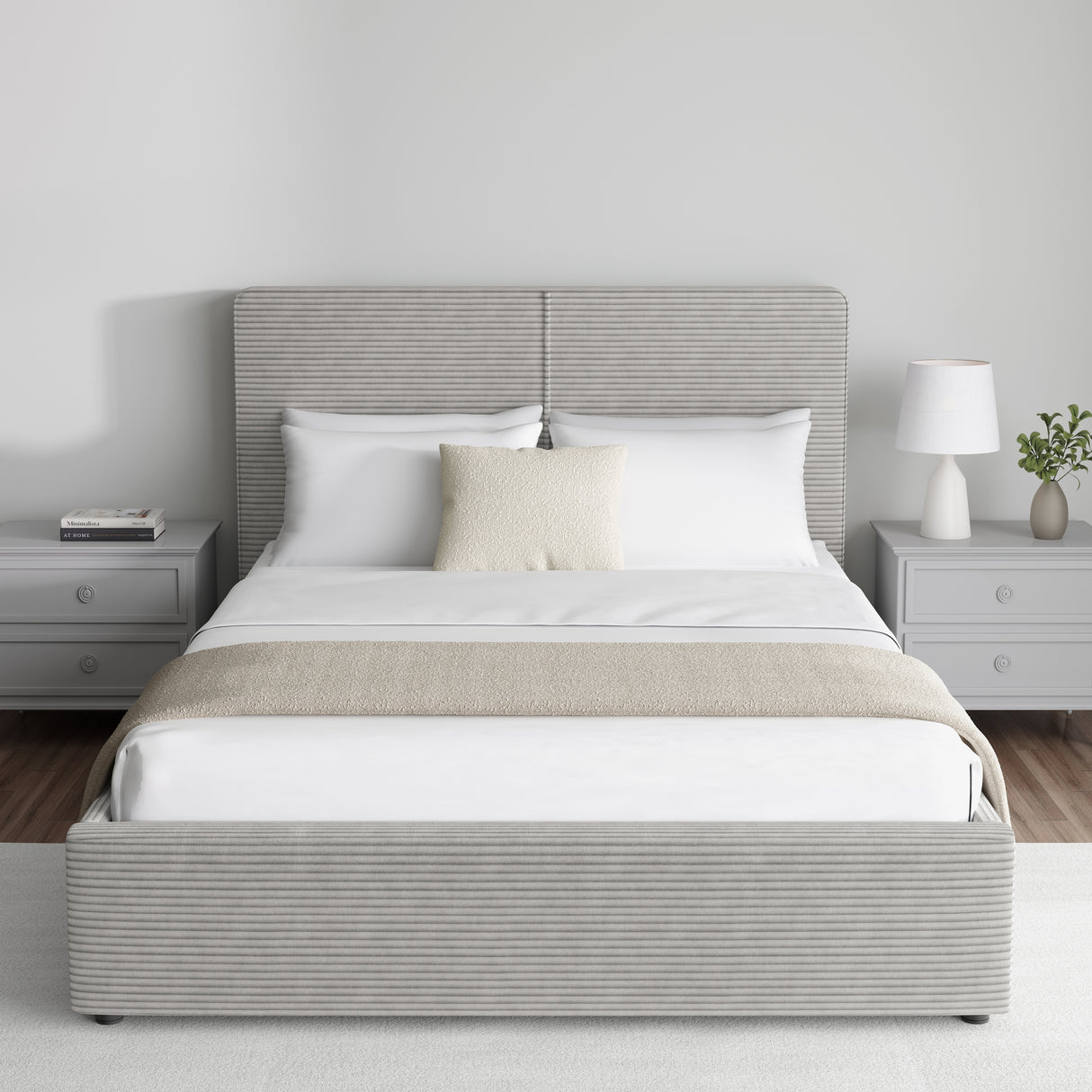 Corduroy ribbed velvet upholstered ottoman bed frame with storage in light grey, featuring a lift-up base and padded headboard, shown in a modern bedroom.