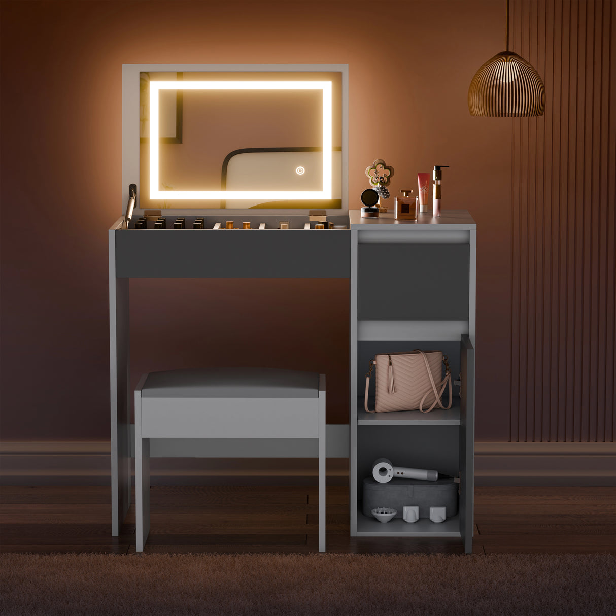 Dressing table with illuminated mirror and various items on a warm-toned wall.